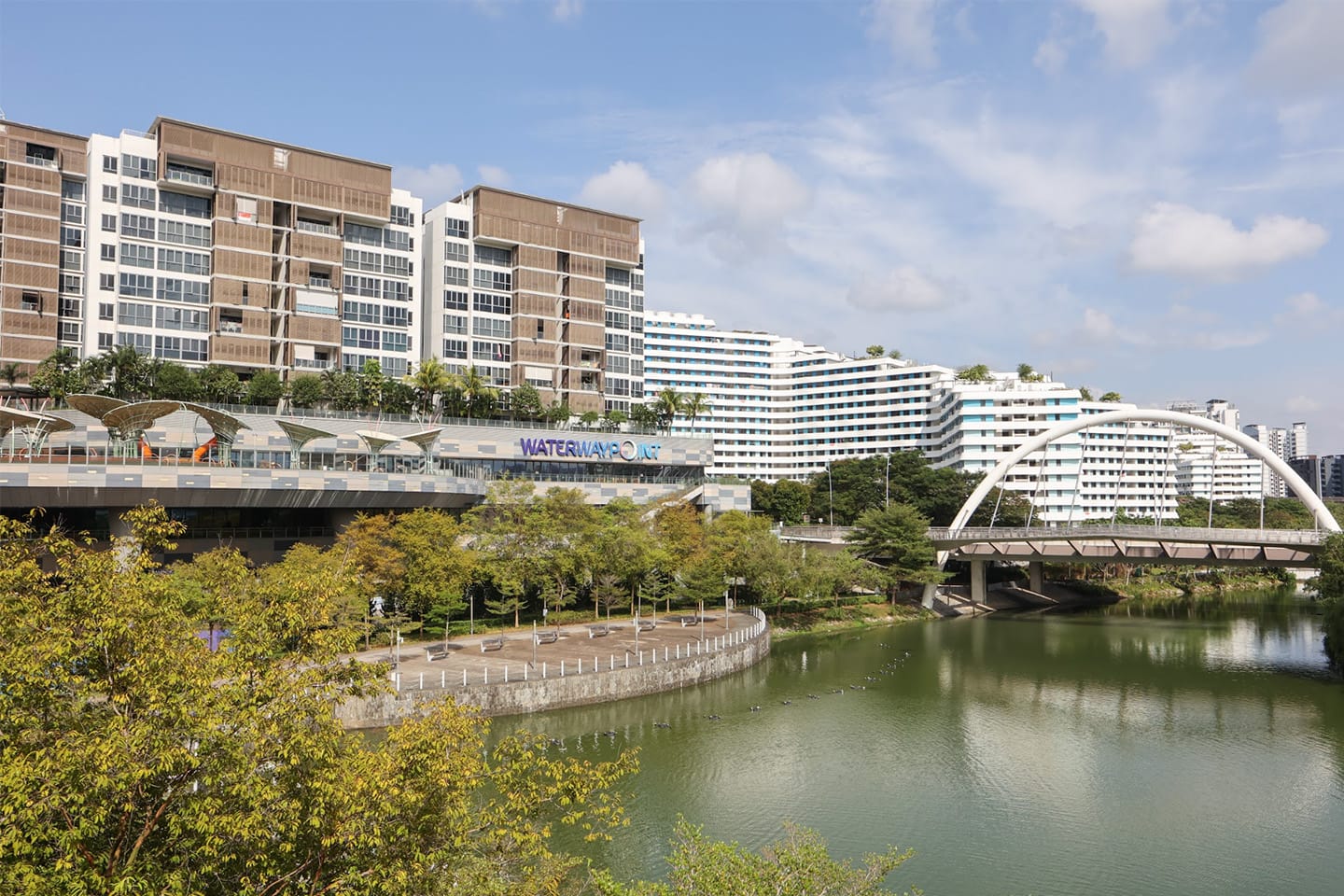 Waterway Point with buildings, bridge and river. Mall signage visible.